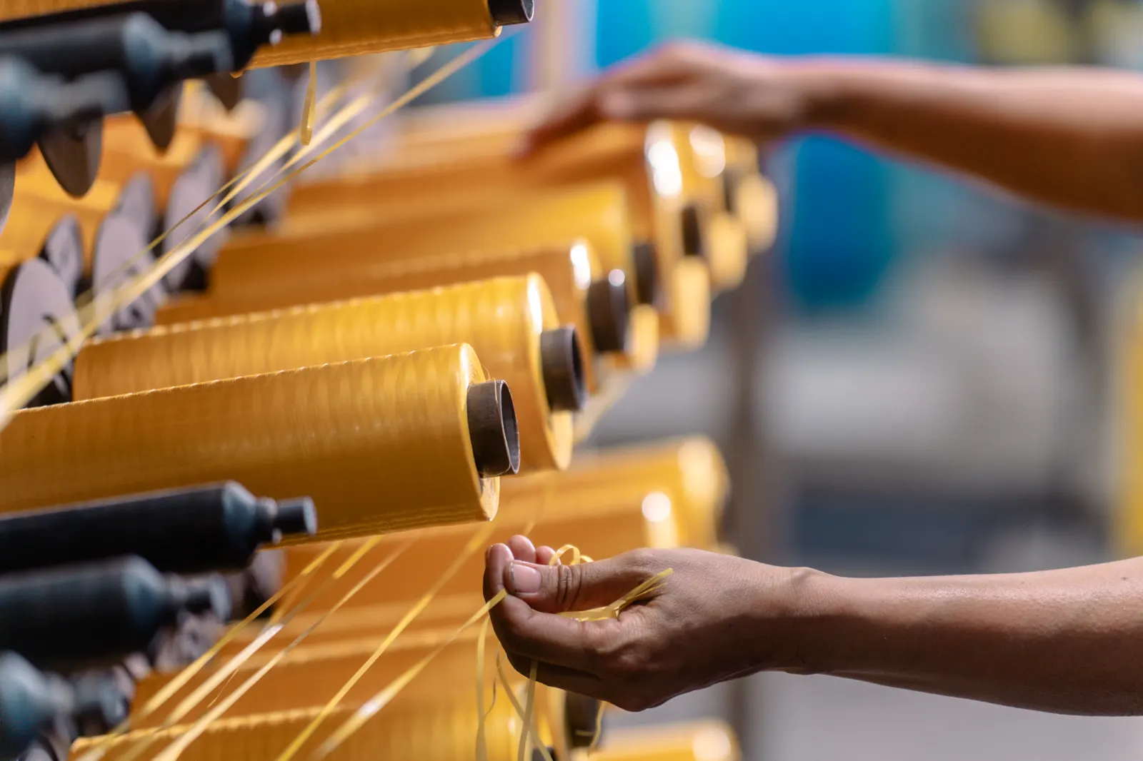 Loom weaving operation detail at Magna